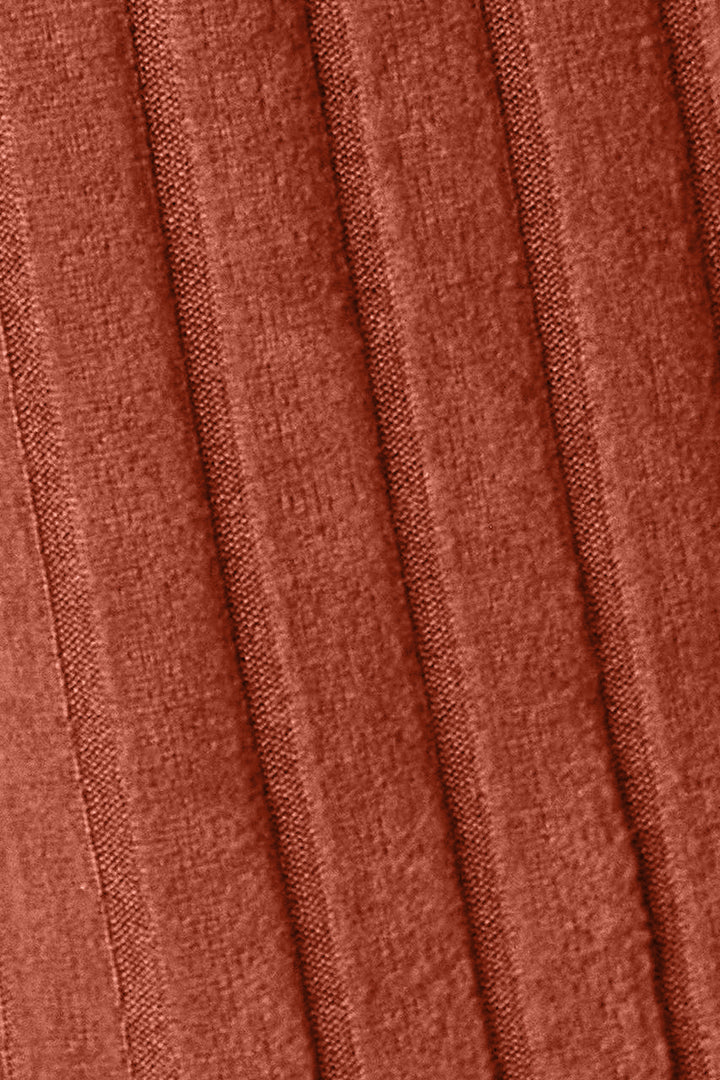 A close-up of the Basic Bae Full Size Hooded Sweater Cardigan showcases its textured fabric with a pleated pattern in a warm, reddish-brown shade. The vertical folds add depth to this pocketed sheer cardigan, giving it an elegant and soft look that is ideal for machine wash cold care.