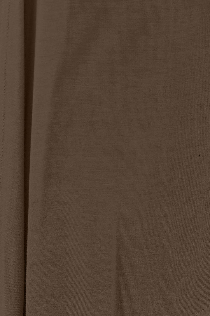 Close-up of the brown fabric from the Basic Bae Full Size Open Front Long Sleeve Cardigan, featuring a soft and smooth texture made from rayon spandex. The image shows a vertical seam on the left, highlighting subtle shadows and natural folds in its slightly stretchy material.