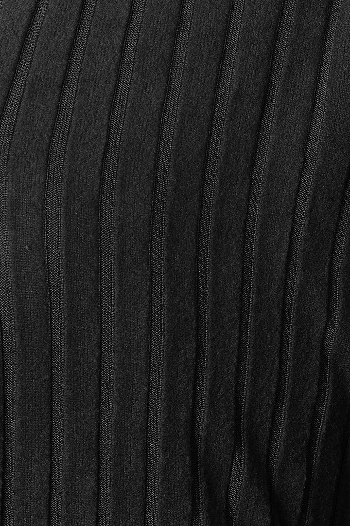 Close-up of the Basic Bae Full Size Ribbed Cocoon Cardigan, showcasing its black textured polyester fabric with vertical ribbed lines and a slightly stretchy quality.