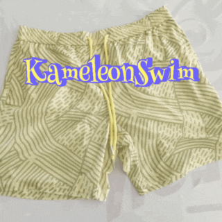 Wave Pattern Mens Color Changing Trunks, featuring beige abstract wave patterns and a yellow drawstring with "Kameleon Swim" text in blue outlined in yellow.