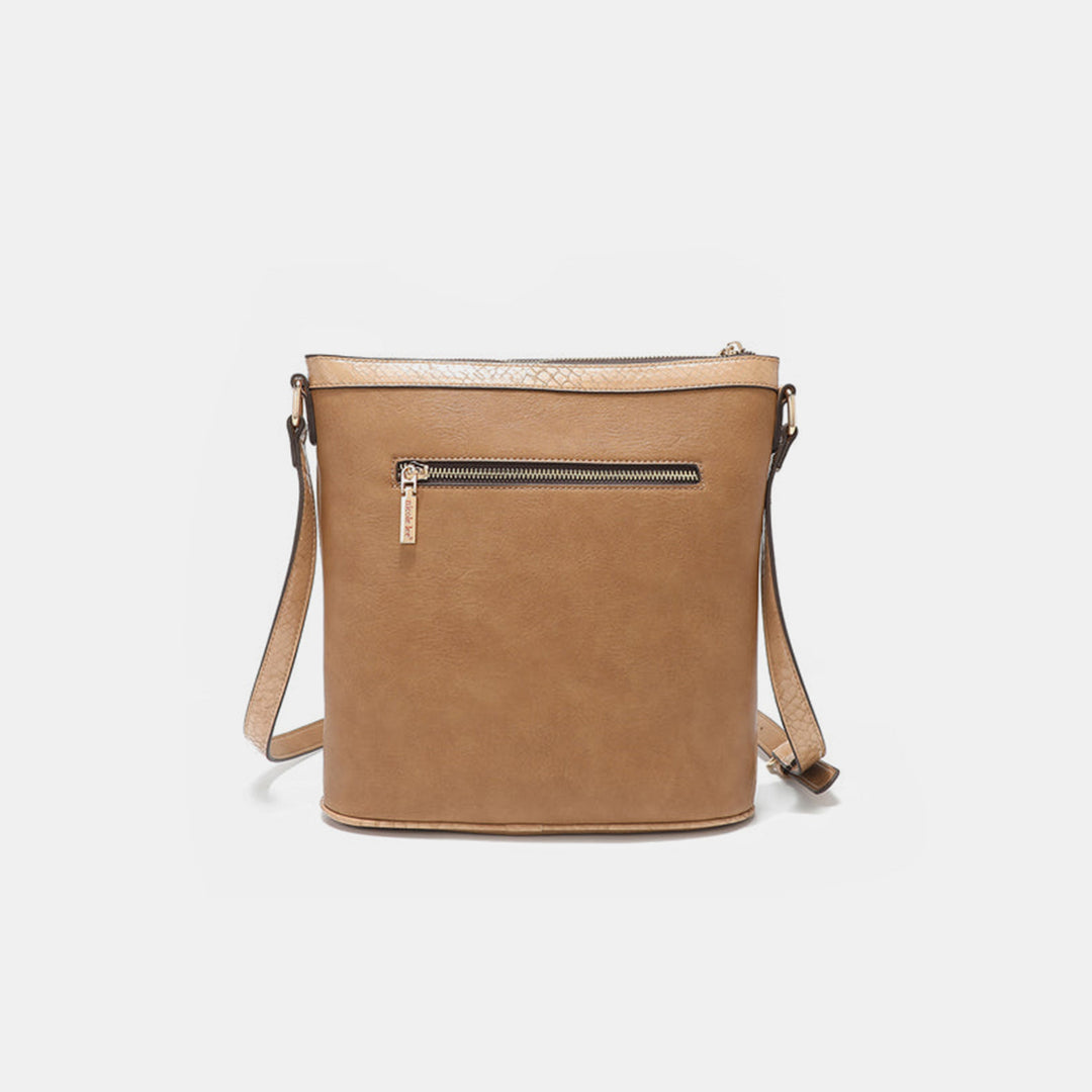 The Nicole Lee USA Metallic Stitching Embroidery Inlaid Rhinestone Crossbody Bag is a tan vegan leather bag with a sleek design. It features a front zipper pocket, shoulder strap, and smooth texture, making it a minimalist style suitable for everyday use.