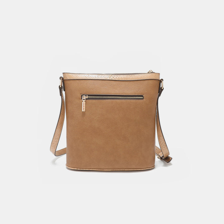 The Nicole Lee USA Metallic Stitching Embroidery Inlaid Rhinestone Crossbody Bag is a tan vegan leather bag with a sleek design. It features a front zipper pocket, shoulder strap, and smooth texture, making it a minimalist style suitable for everyday use.